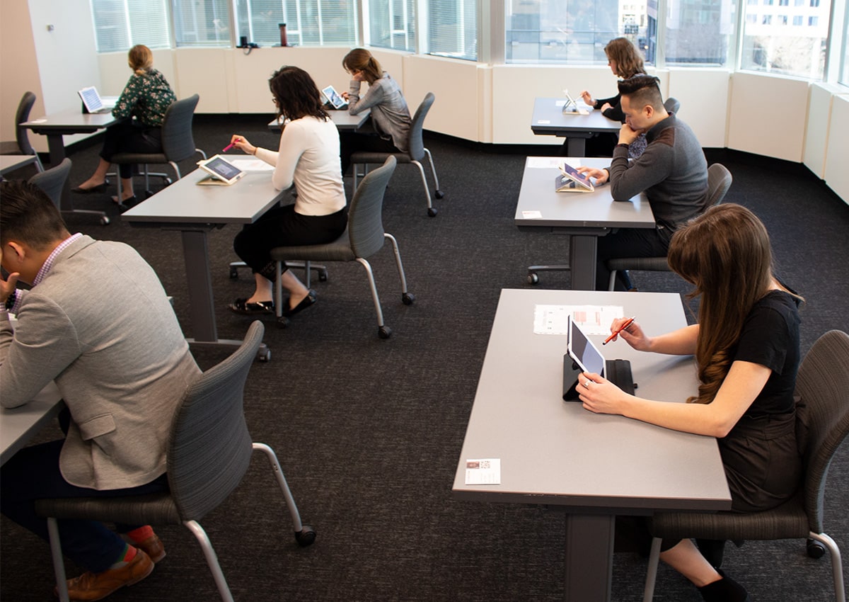 students working on tablets at desks